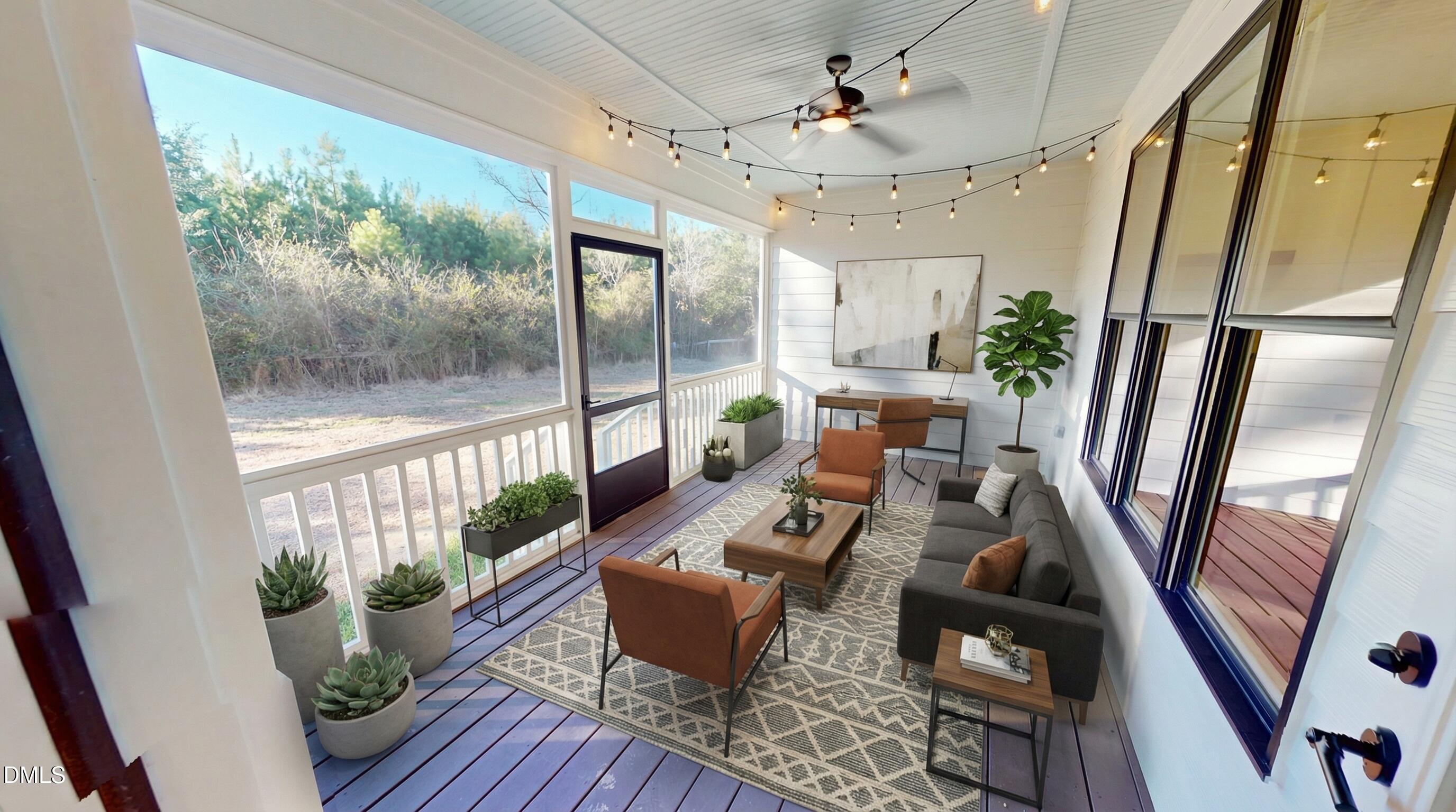 5009 Hopkins Chapel Road Zebulon, NC 27597 - Photo 8 of 28 a living room with furniture floor to ceiling window and wooden floor