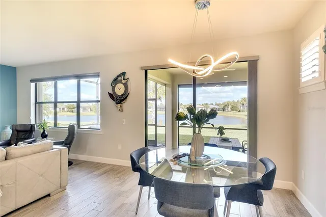 a view of a dining room with furniture window and wooden floor
