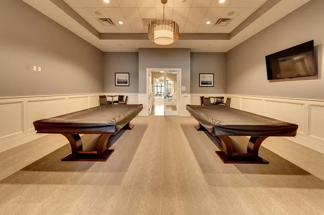 a front view of multiple houses with yard