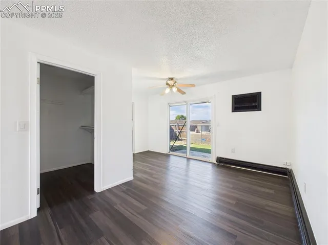 a view of a livingroom with wooden floor