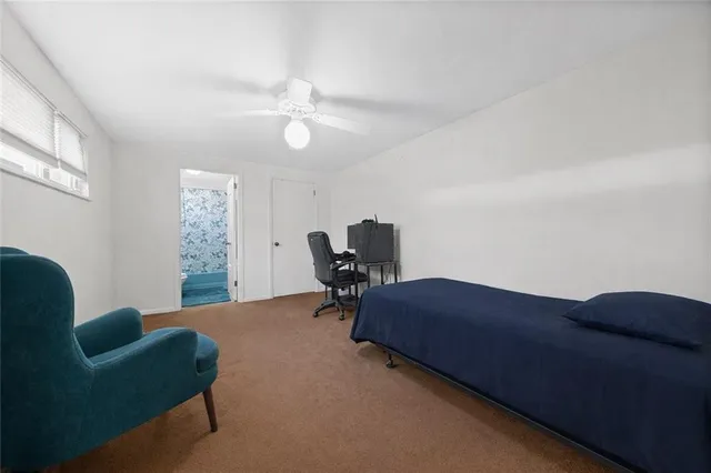 a bedroom with furniture and a chandelier