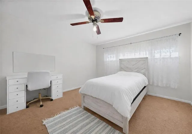 a bedroom with a bed and a cabinets