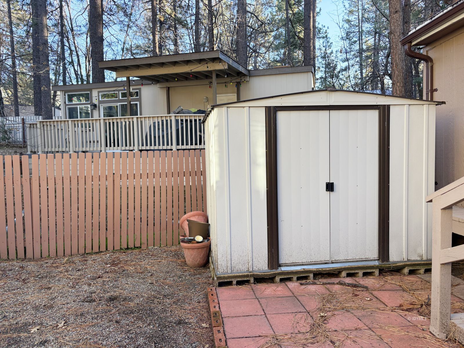 25955 Highway 243, Unit 25 Idyllwild, CA 92549 - Photo 13 of 38 a side view of a house with a wooden fence