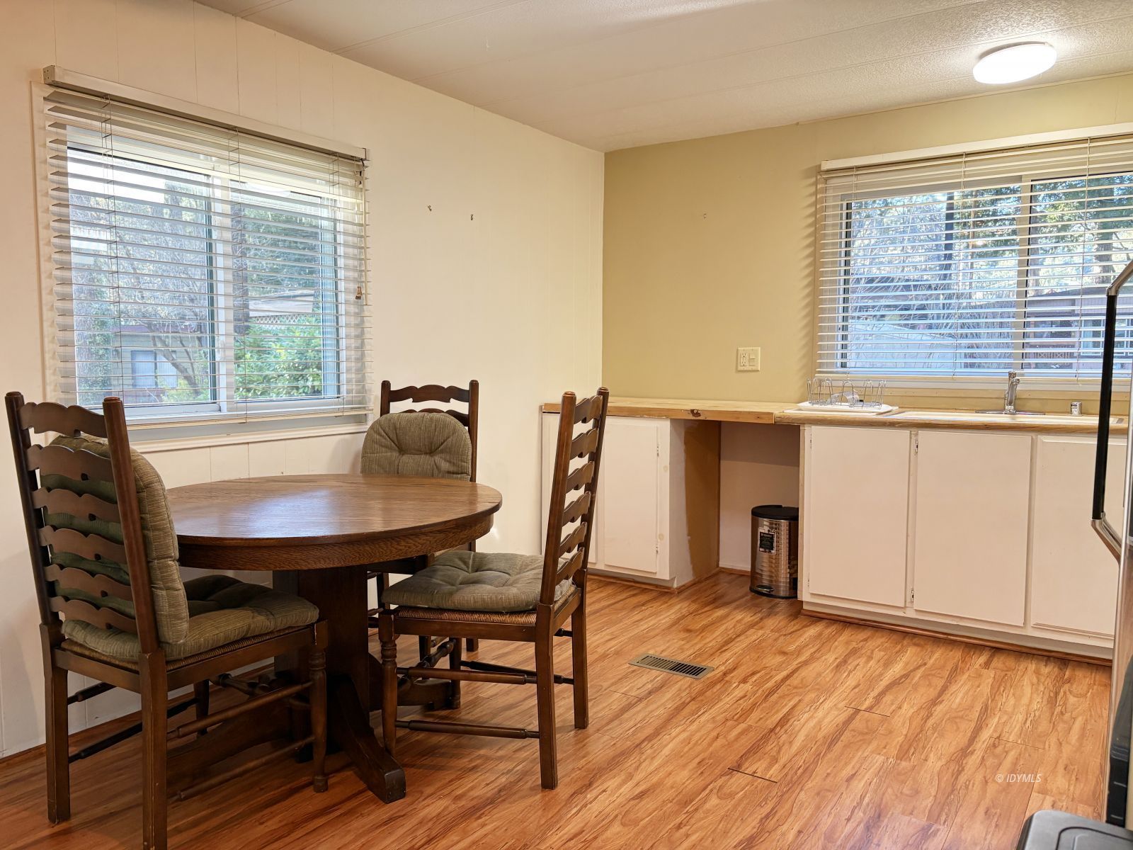 25955 Highway 243, Unit 25 Idyllwild, CA 92549 - Photo 21 of 38 a view of a dining room with furniture and wooden floor