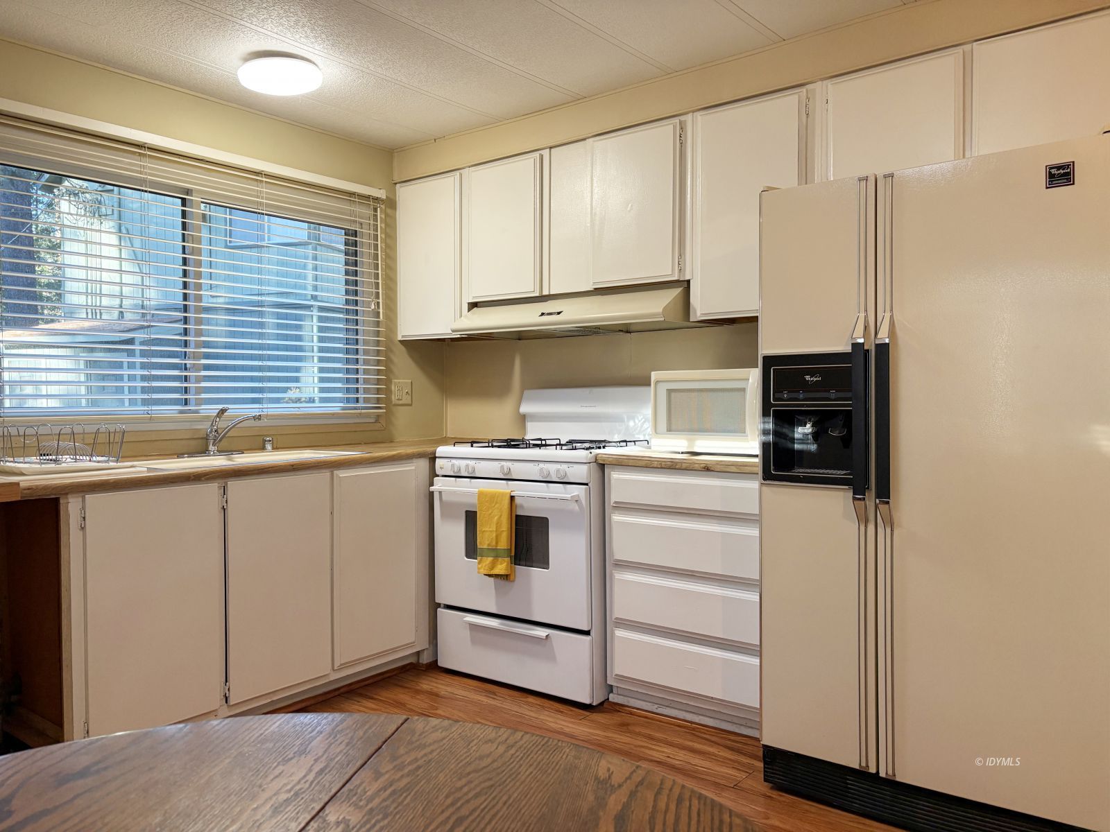 25955 Highway 243, Unit 25 Idyllwild, CA 92549 - Photo 22 of 38 a kitchen with stainless steel appliances cabinets and a window