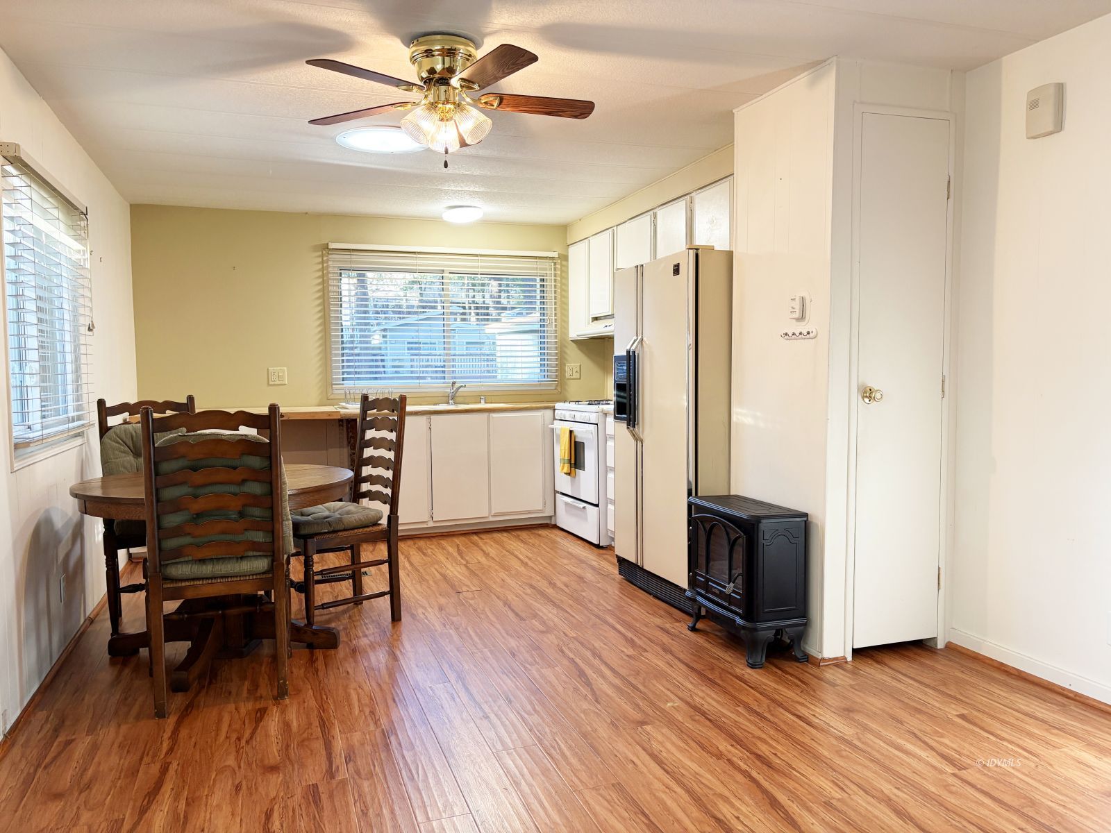 25955 Highway 243, Unit 25 Idyllwild, CA 92549 - Photo 7 of 38 a view of kitchen with furniture and wooden floor