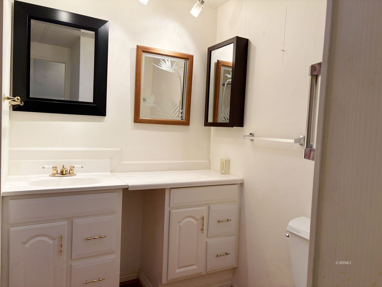 25955 Highway 243, Unit 25 Idyllwild, CA 92549 - Photo 10 of 38 a bathroom with a double vanity sink and mirror
