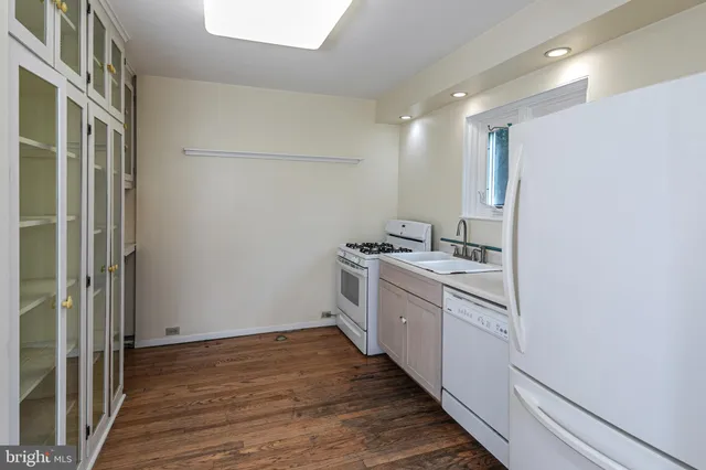 a view of a kitchen with a sink and dishwasher