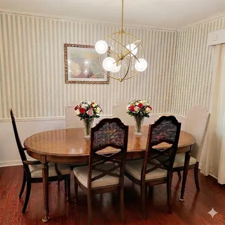 a dining room with furniture and chandelier