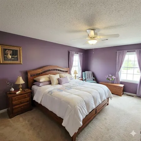 a bedroom with bed and a chandelier