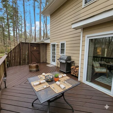 a view of a deck with wooden floor and outdoor seating