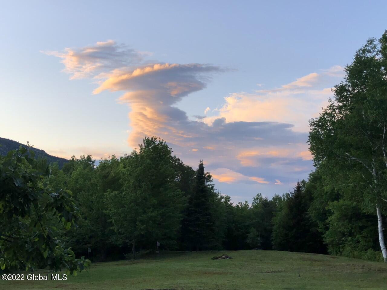 175 Henry Wescott Road Thurman, NY 12885 - Photo 51 of 55 Cloud formations over meadow