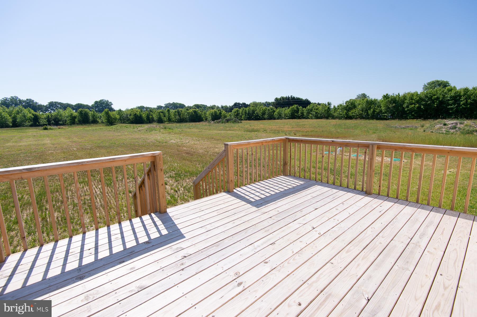Wrights Rest Road Hurlock, MD 21643 - Photo 19 of 22 a view of wooden deck with a lake