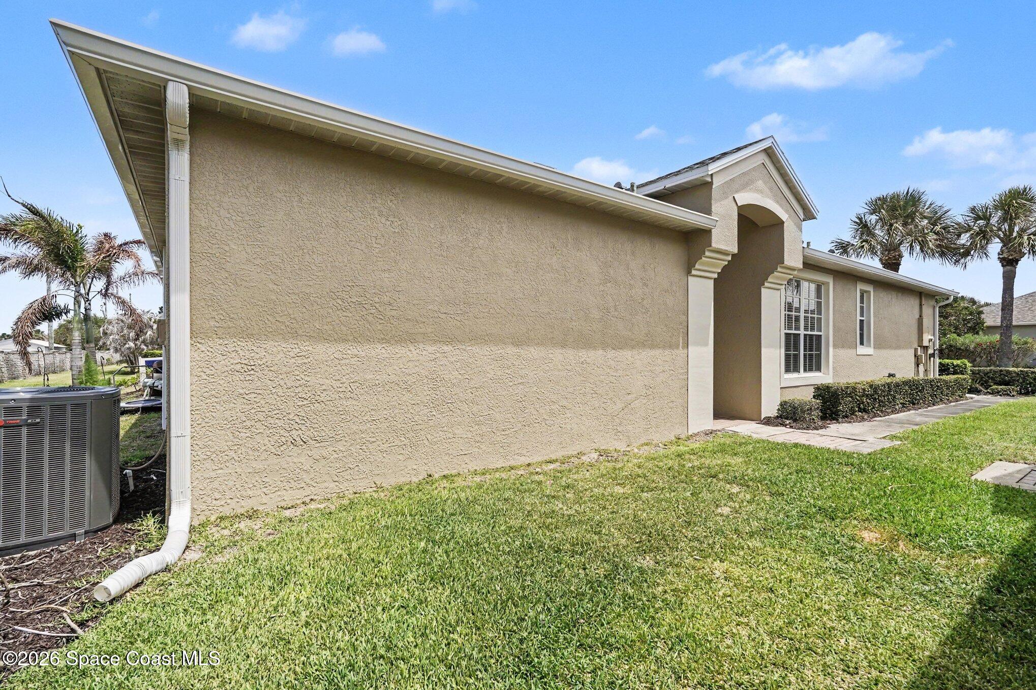 284 Intrepid Way Indialantic, FL 32903 - Photo 4 of 36 a front view of a house with a yard