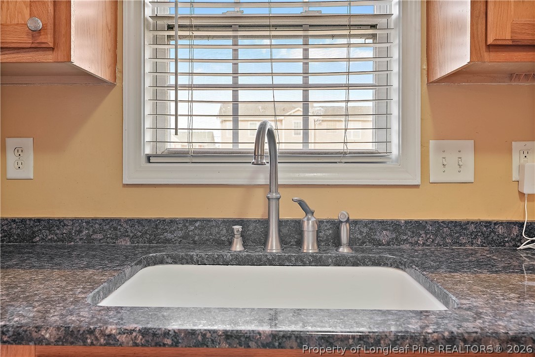 1404 Rough Rider Lane Parkton, NC 28371 - Photo 13 of 32 a bathroom with bathtub and window