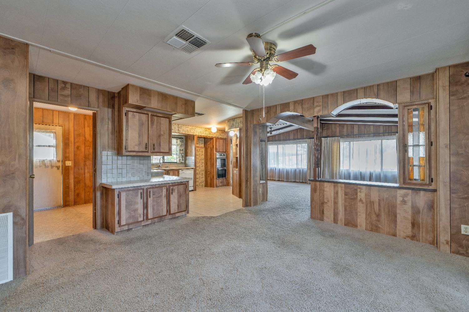 4420 Pleasant Valley Road, Unit 116 Diamond Springs, CA 95619 - Photo 11 of 28 a view of an empty room with window and cabinet