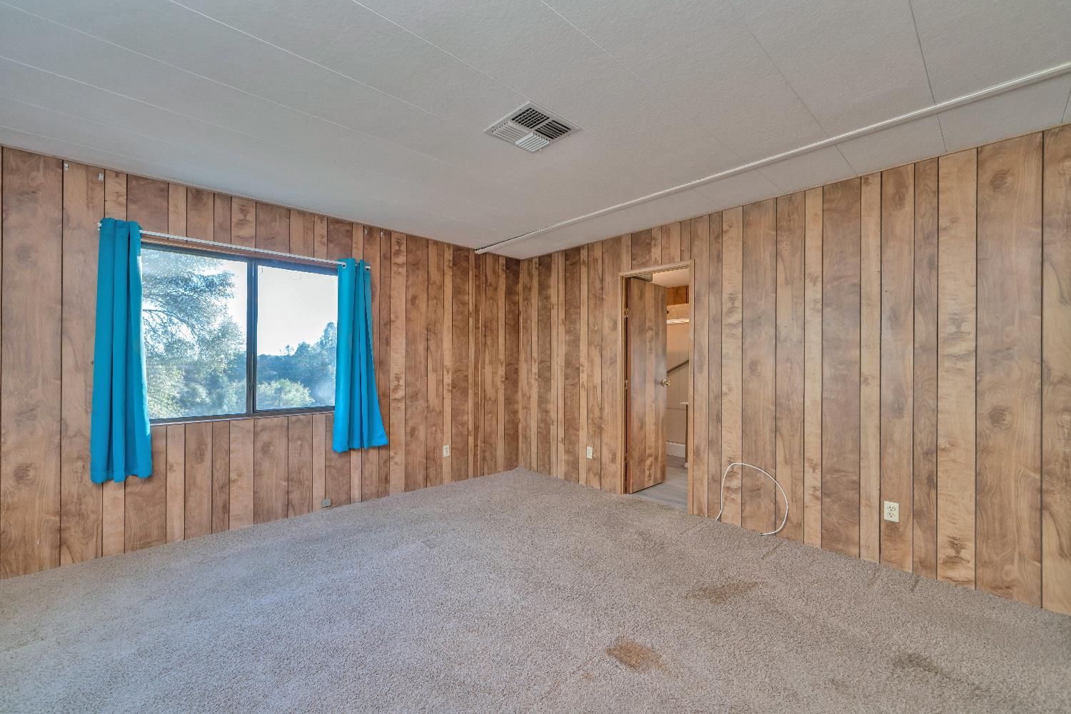 4420 Pleasant Valley Road, Unit 116 Diamond Springs, CA 95619 - Photo 15 of 28 a view of an empty room with a window