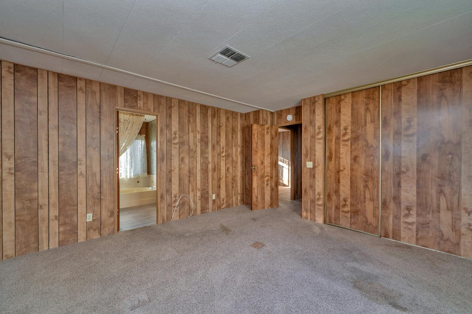 4420 Pleasant Valley Road, Unit 116 Diamond Springs, CA 95619 - Photo 16 of 28 a view of an empty room with a window