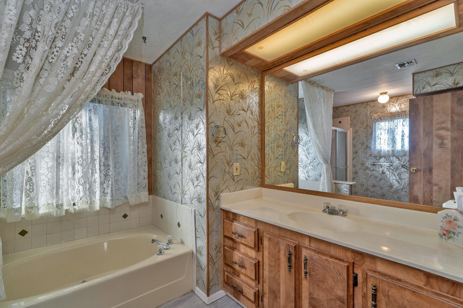 4420 Pleasant Valley Road, Unit 116 Diamond Springs, CA 95619 - Photo 17 of 28 a bathroom with a bathtub and a sink
