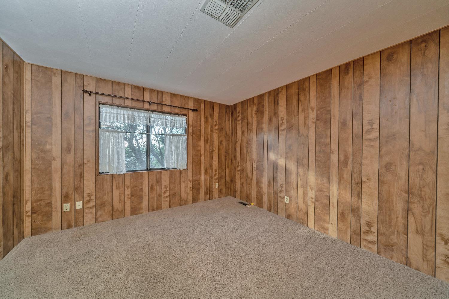 4420 Pleasant Valley Road, Unit 116 Diamond Springs, CA 95619 - Photo 20 of 28 a view of a livingroom with wooden floor and a window