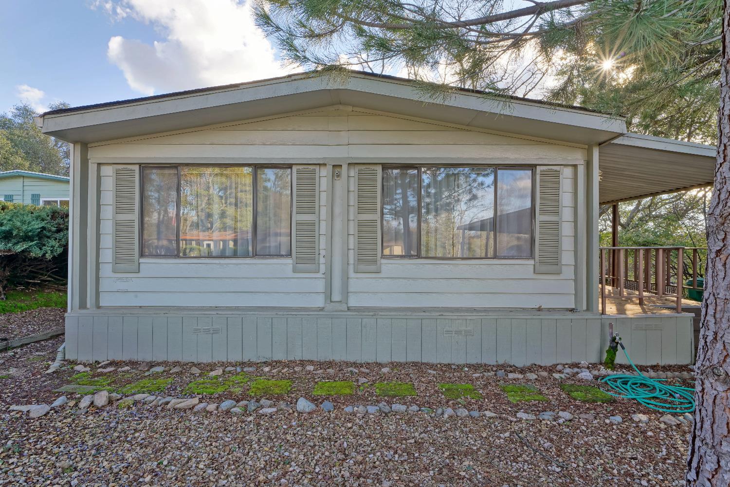 4420 Pleasant Valley Road, Unit 116 Diamond Springs, CA 95619 - Photo 2 of 28 a front view of a house with a yard