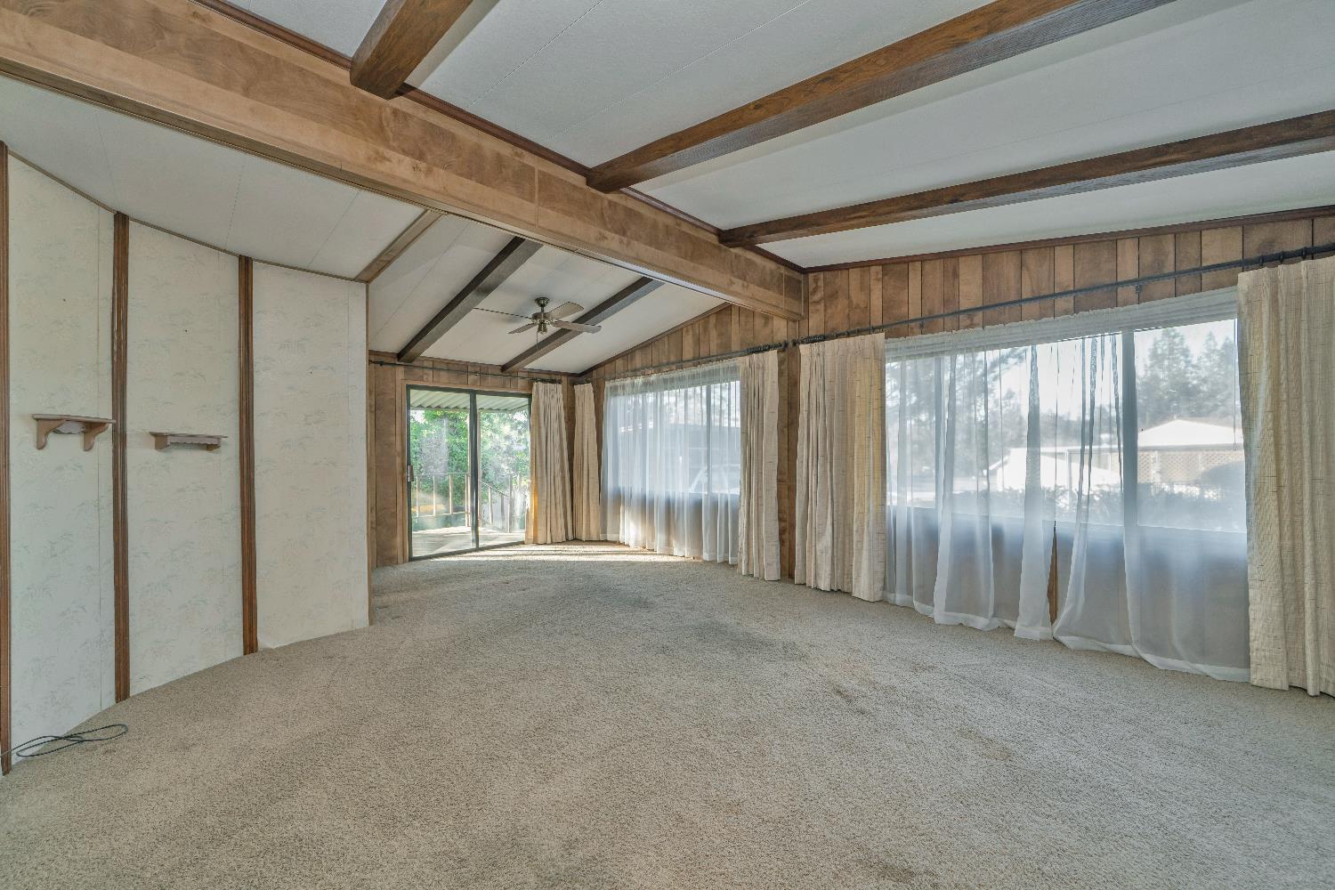 4420 Pleasant Valley Road, Unit 116 Diamond Springs, CA 95619 - Photo 3 of 28 a view of an empty room with windows