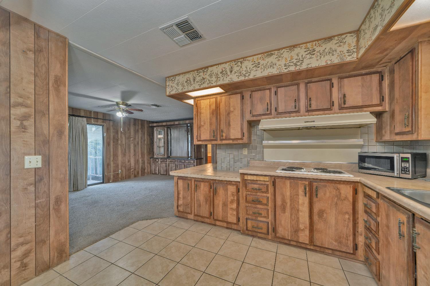 4420 Pleasant Valley Road, Unit 116 Diamond Springs, CA 95619 - Photo 9 of 28 a kitchen with stainless steel appliances granite countertop a sink and cabinets