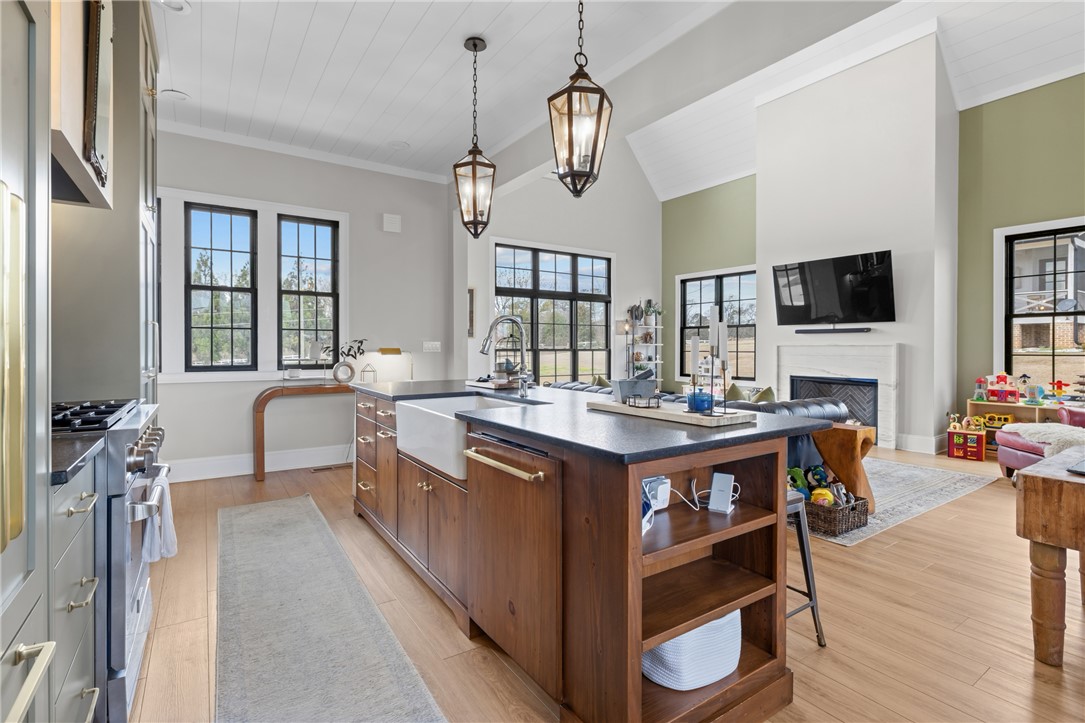 677 Lightwood Road Hartwell, GA 30643 - Photo 11 of 42 This open concept design seamlessly connects the kitchen to the living area, fostering a harmonious flow.