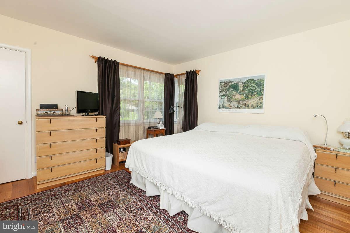 1331 Heather Hill Road Baltimore, MD 21239 - Photo 12 of 28 a bedroom with a bed and a flat screen tv