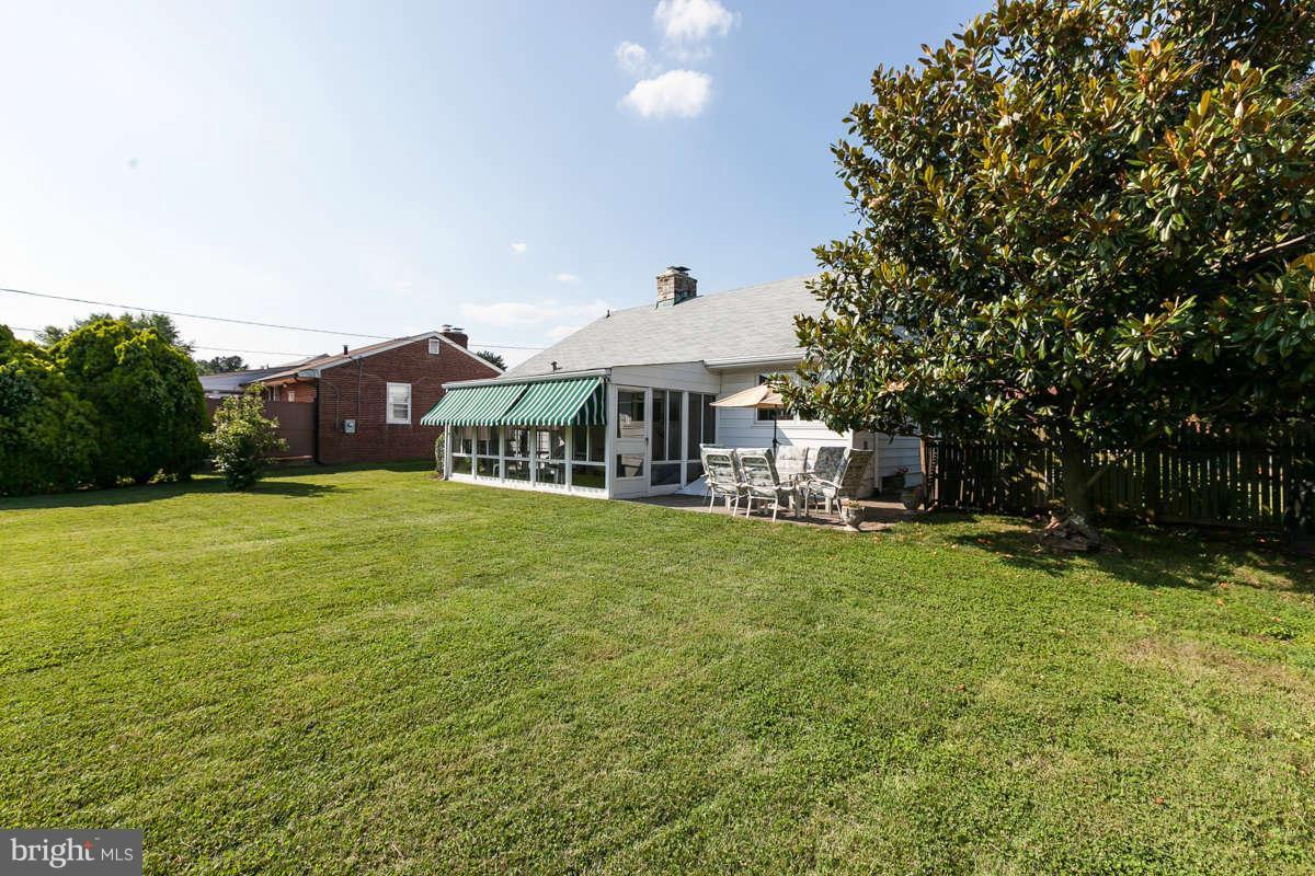1331 Heather Hill Road Baltimore, MD 21239 - Photo 23 of 28 a front view of a house with garden