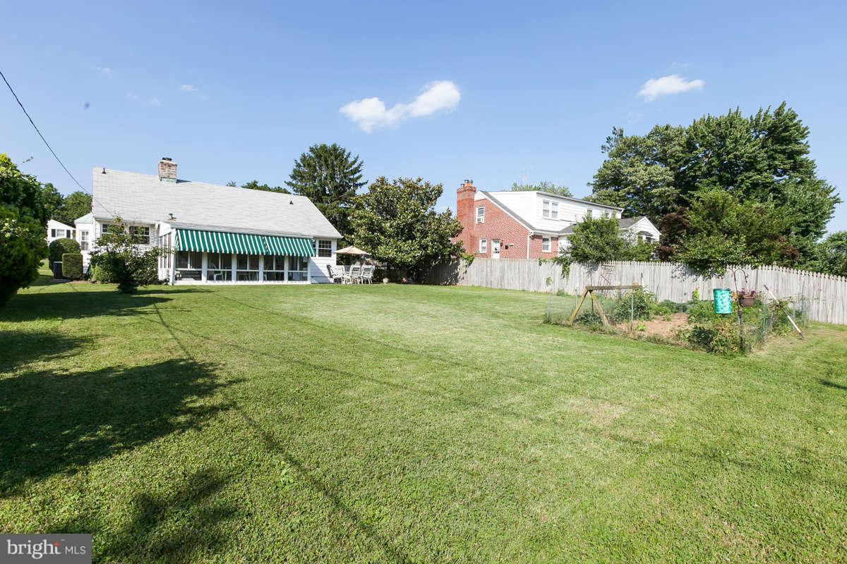 1331 Heather Hill Road Baltimore, MD 21239 - Photo 26 of 28 a view of a house with a big yard