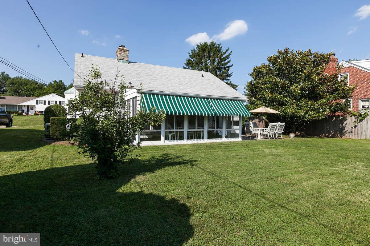 1331 Heather Hill Road Baltimore, MD 21239 - Photo 27 of 28 a view of a house with a yard