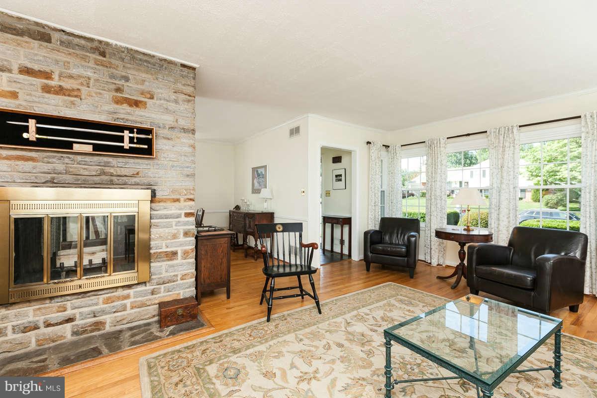 1331 Heather Hill Road Baltimore, MD 21239 - Photo 5 of 28 a living room with furniture and a fireplace