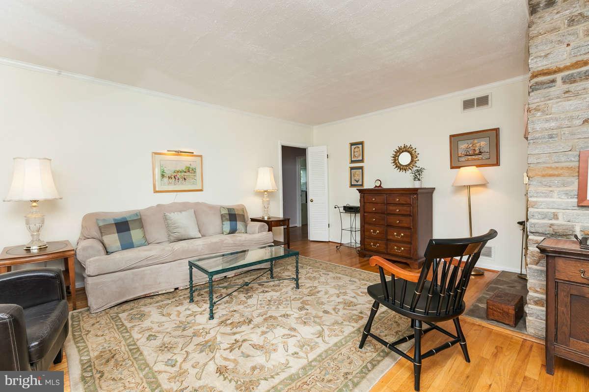 1331 Heather Hill Road Baltimore, MD 21239 - Photo 6 of 28 a living room with furniture and wooden floor