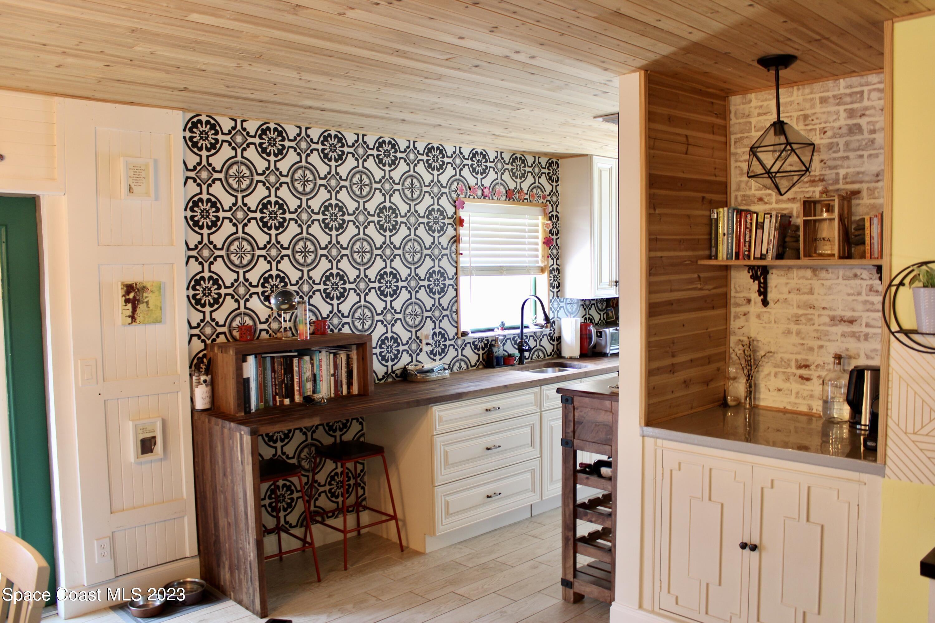 17416 Thrush Drive Jupiter, FL 33458 - Photo 12 of 28 a kitchen with a refrigerator and a stove