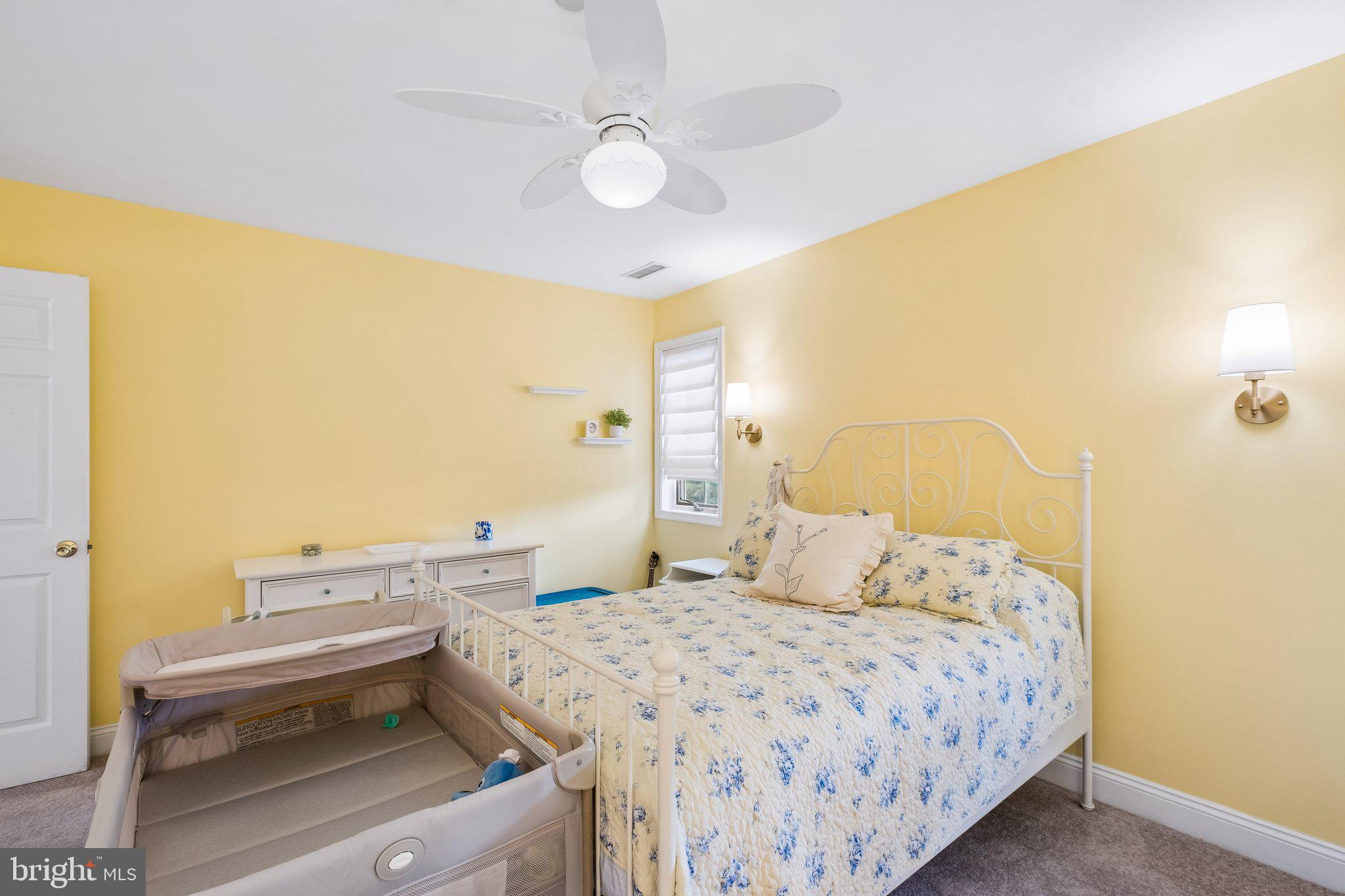 305 Langford Road Broomall, PA 19008 - Photo 57 of 83 a bedroom with a bed and a chandelier