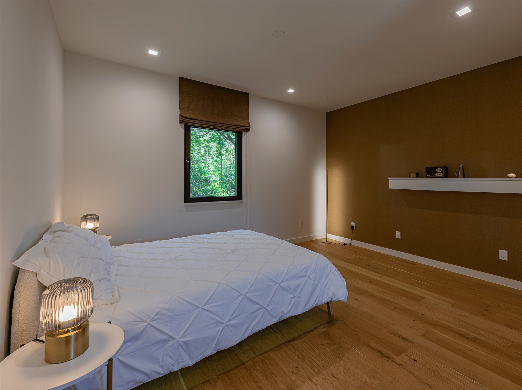 2806 Geronimo Trail Austin, TX 78734 - Photo 19 of 36 a bedroom with a bed and a lamp