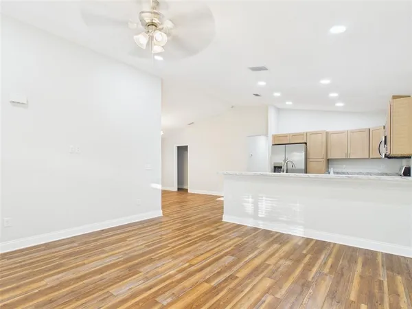 a view of kitchen with wooden floor