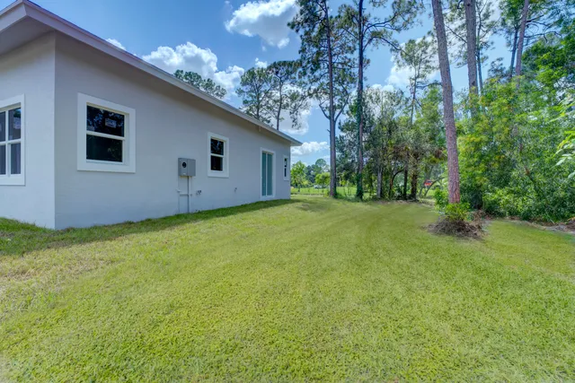 a backyard of a house with lots of green space