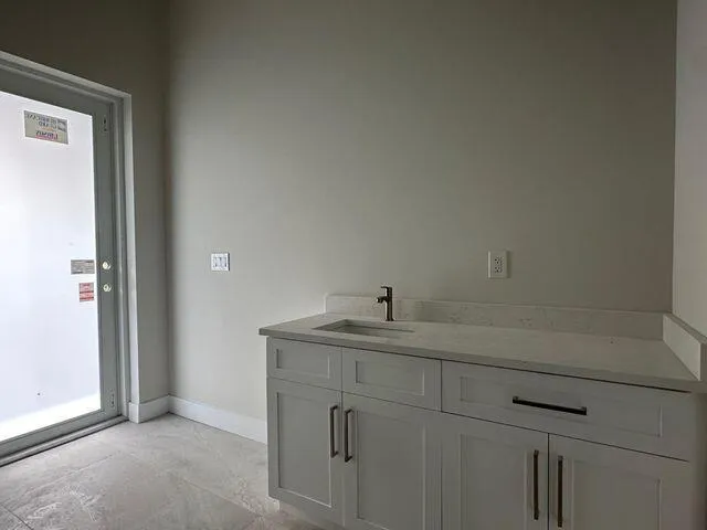 a bathroom with a sink and vanity