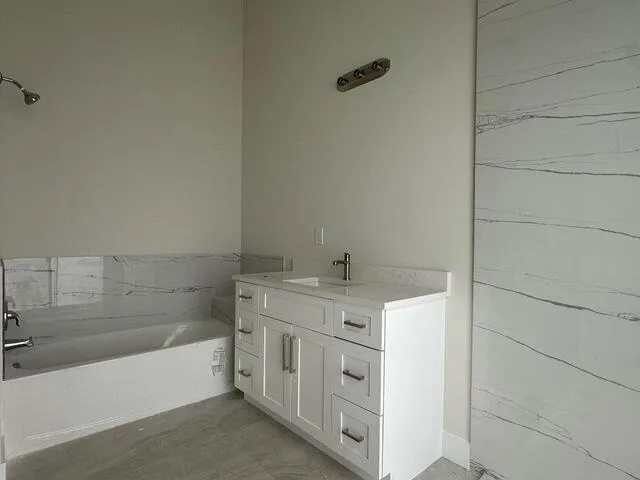 a bathroom with a sink and a bathtub