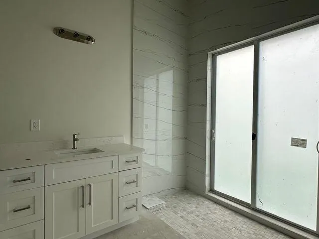a bathroom with a sink and a mirror