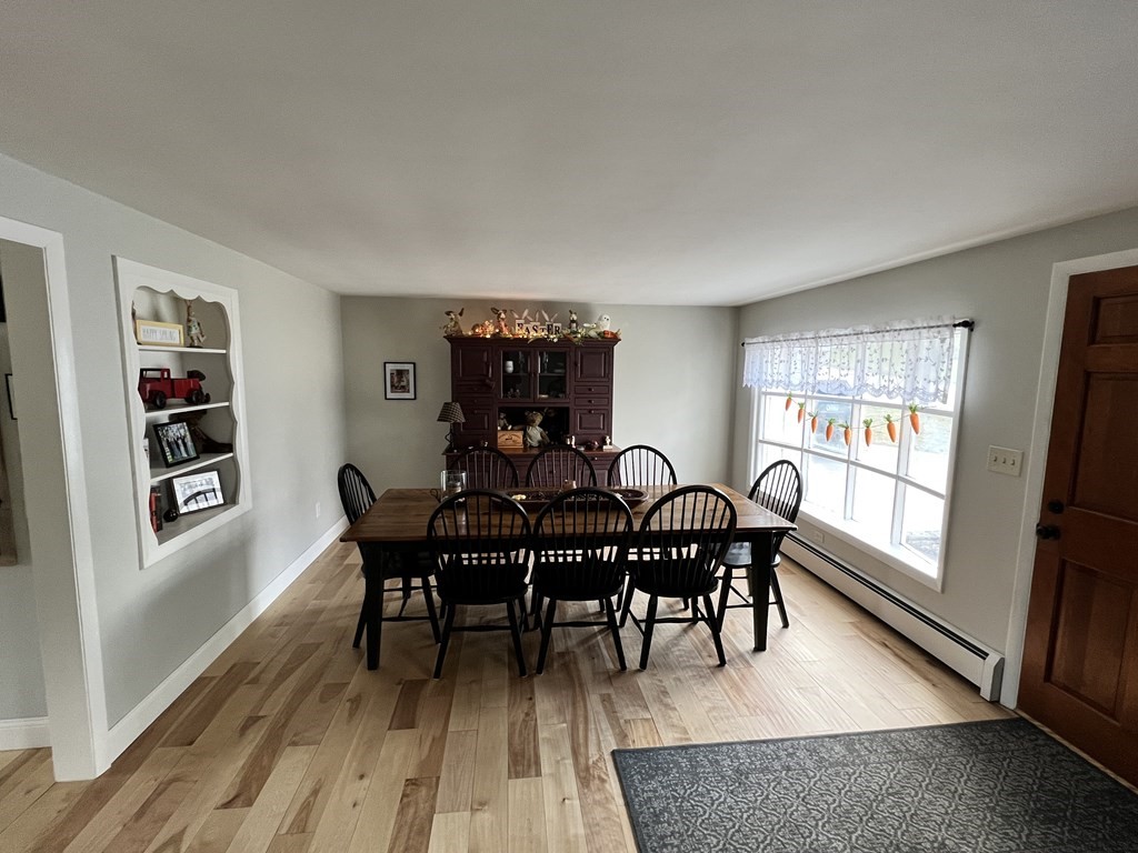 12 Sawmill Road Dudley, MA 01571 - Photo 11 of 37 a view of a dining room with furniture and wooden floor
