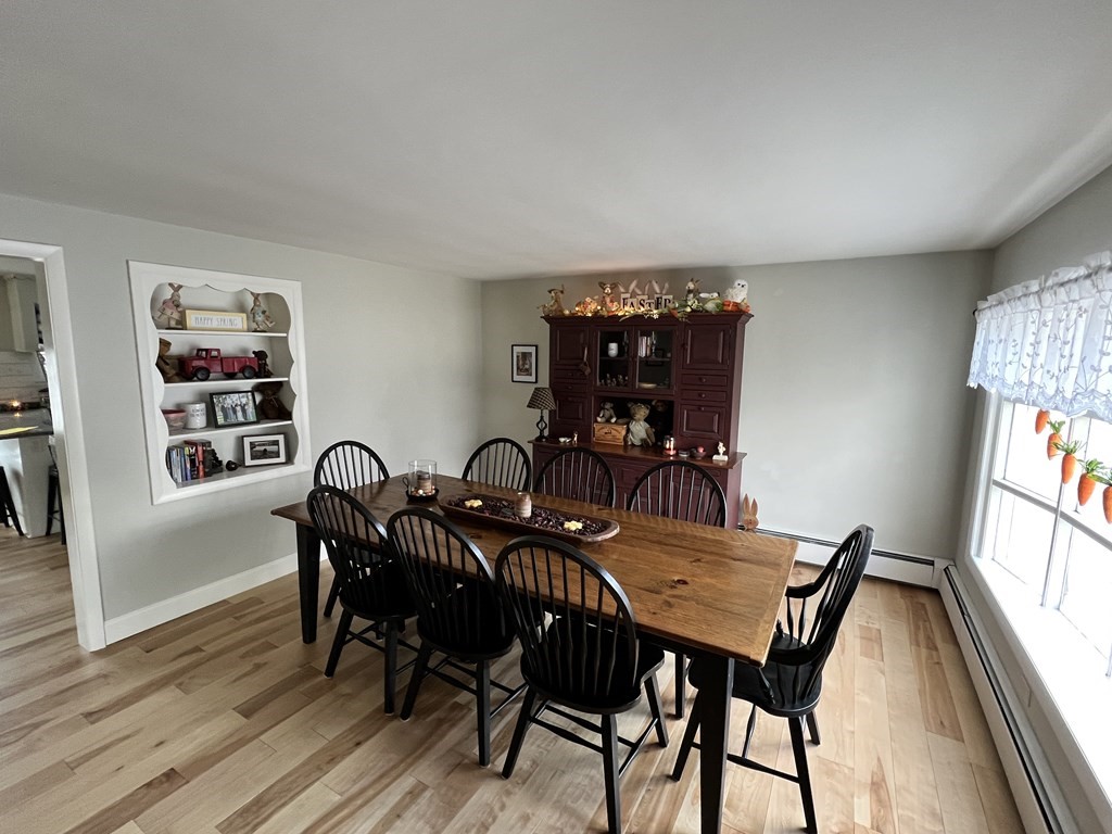 12 Sawmill Road Dudley, MA 01571 - Photo 12 of 37 a view of a dining room with furniture and wooden floor