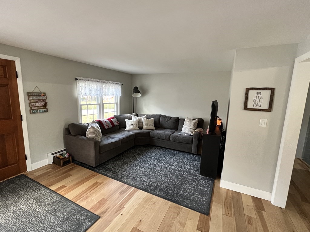 12 Sawmill Road Dudley, MA 01571 - Photo 13 of 37 a living room with furniture and wooden floor