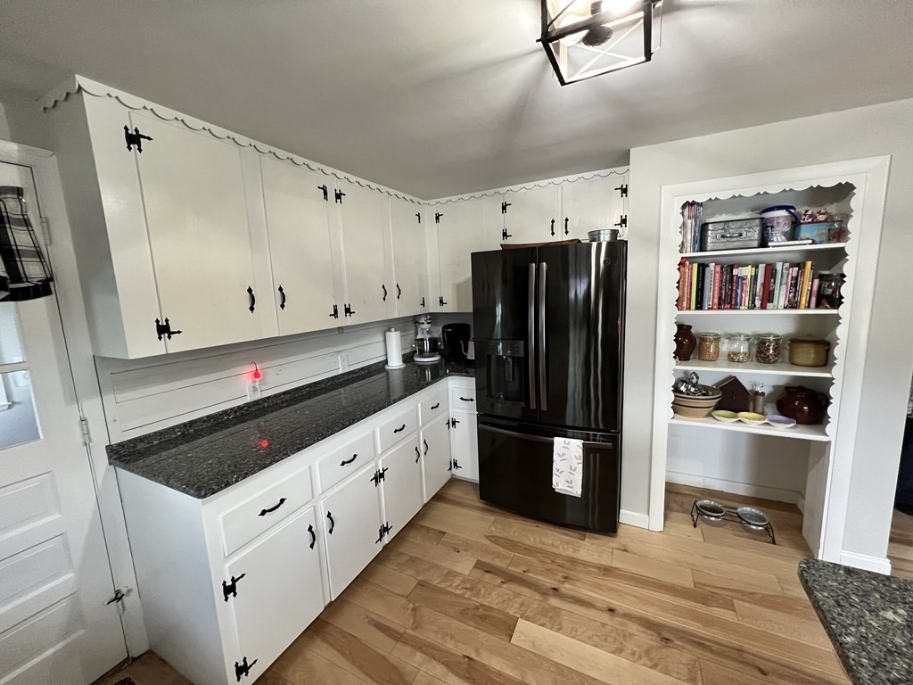 12 Sawmill Road Dudley, MA 01571 - Photo 18 of 37 a kitchen with stainless steel appliances a refrigerator and a stove top oven