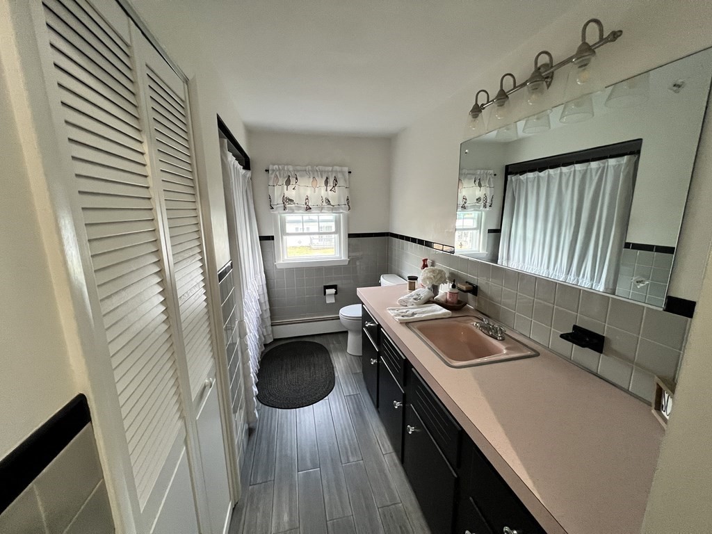 12 Sawmill Road Dudley, MA 01571 - Photo 22 of 37 a kitchen with a sink appliances and cabinets