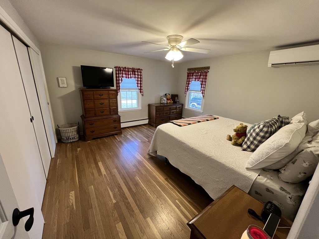 12 Sawmill Road Dudley, MA 01571 - Photo 25 of 37 a living room with furniture and a flat screen tv