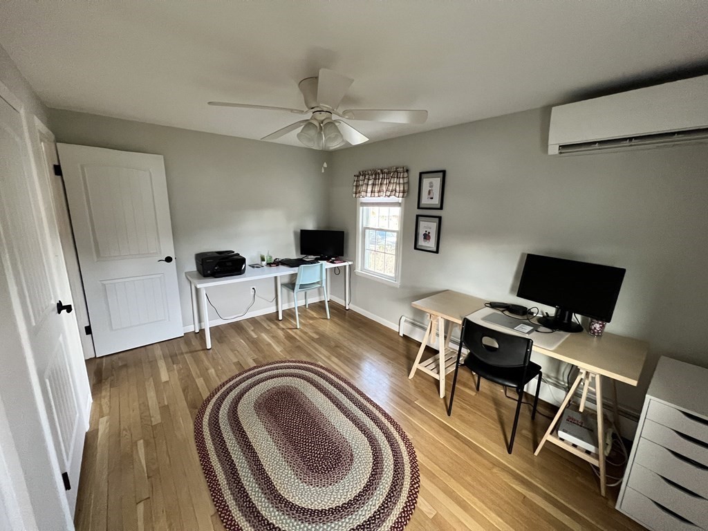 12 Sawmill Road Dudley, MA 01571 - Photo 30 of 37 a view of a workspace with furniture and a flat screen tv