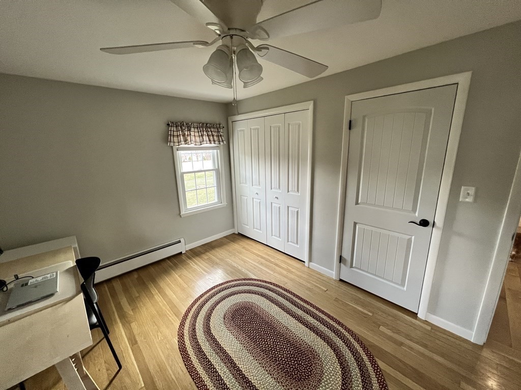 12 Sawmill Road Dudley, MA 01571 - Photo 31 of 37 a view of empty room with window and wooden floor
